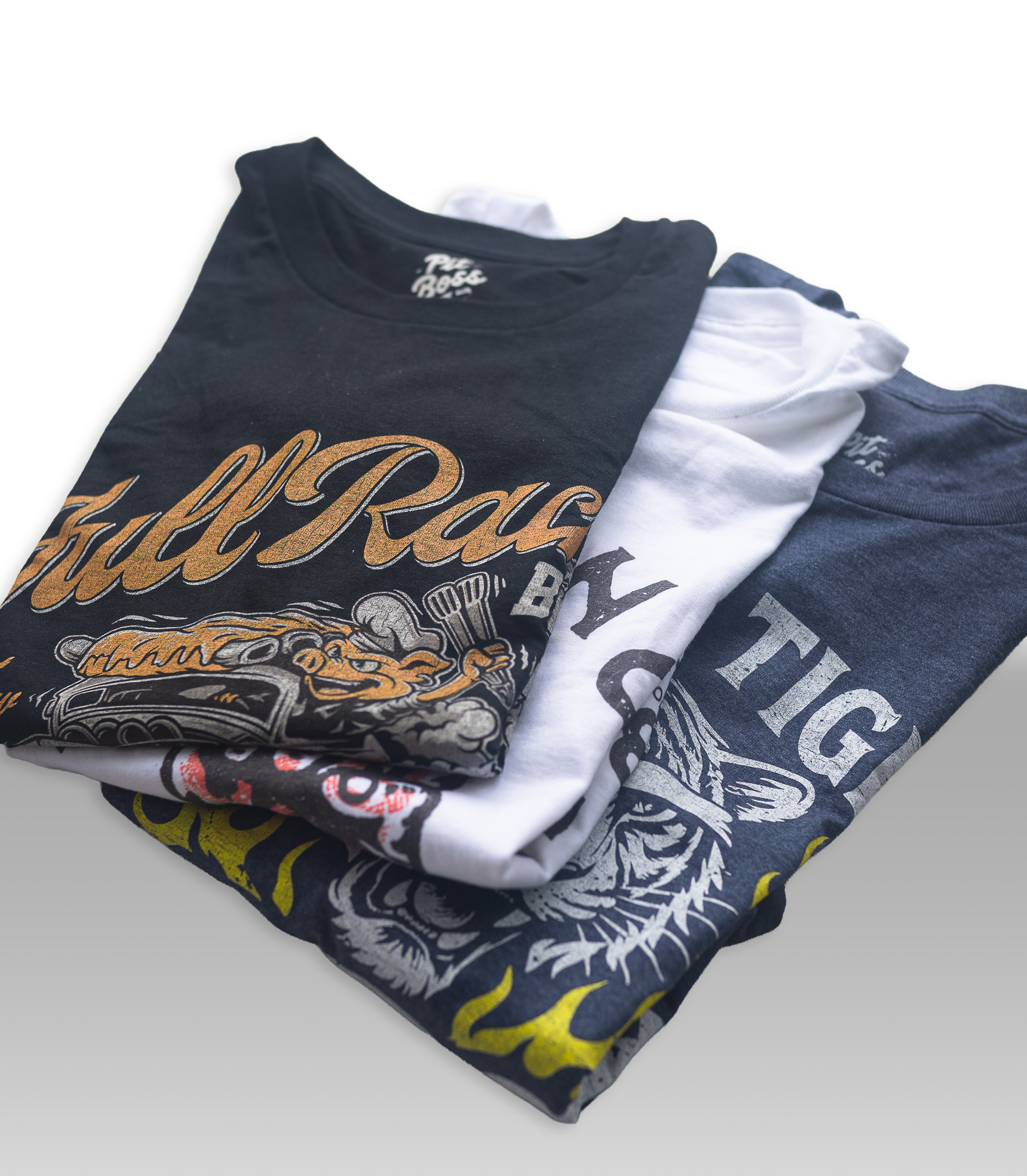 Stack of folded t-shirts with visible branding on a white background